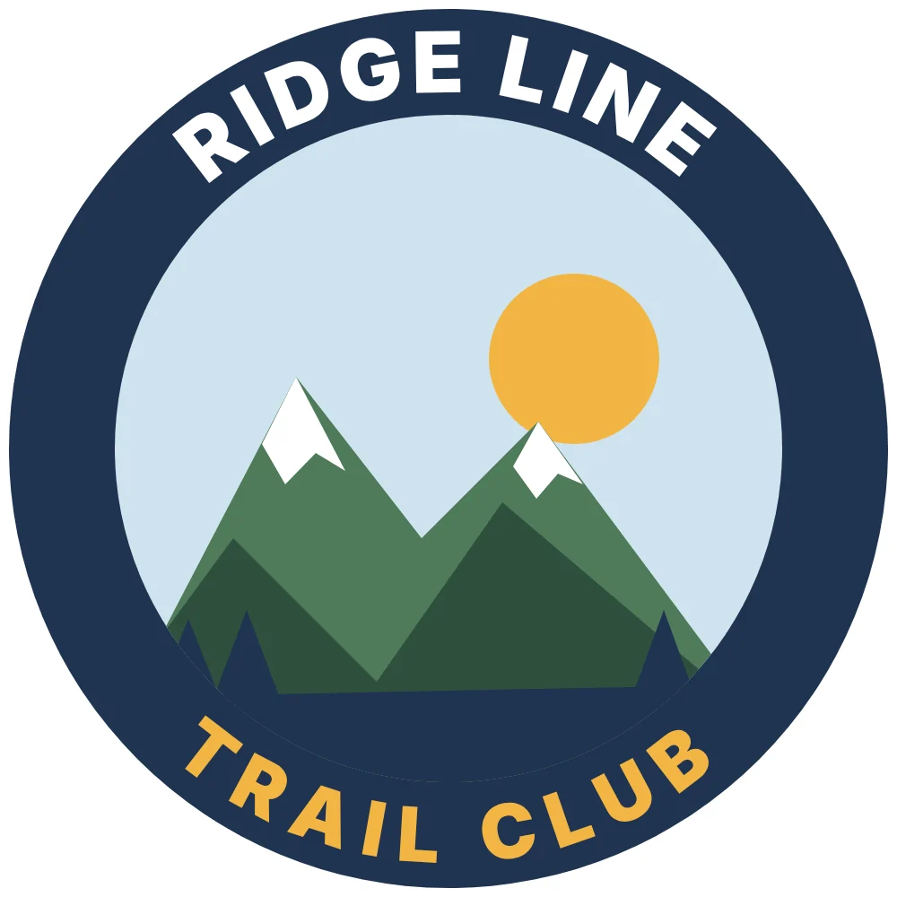 Original art: a round badge with mountains, a sun and arched lettering